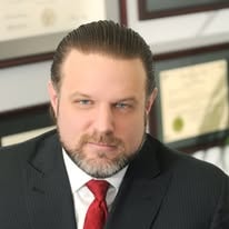 Michael E. Damico in his office